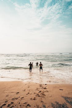 People Running Near Seashore at Daytime Photo